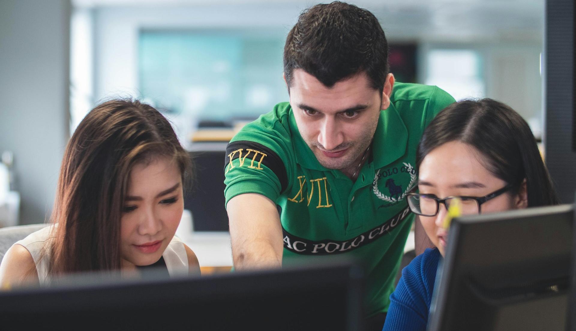 two women and one man on computer screen